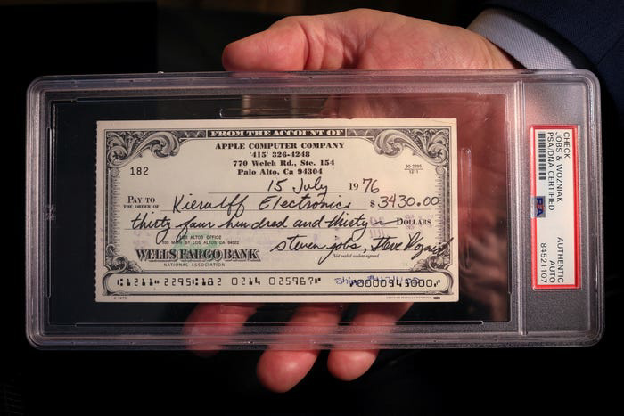 A 1976 Apple Computer check signed by founders Steve Jobs and Steve Wozniak is displayed during a preview of items offered in RR Auction's 